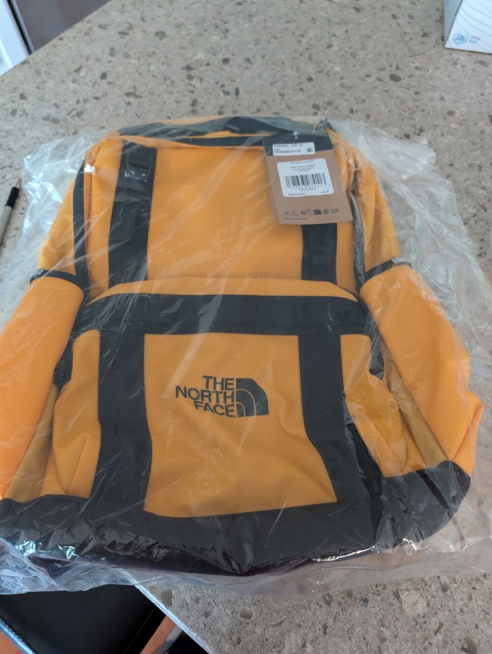 The North Face Yellow and Black Logo Backpack